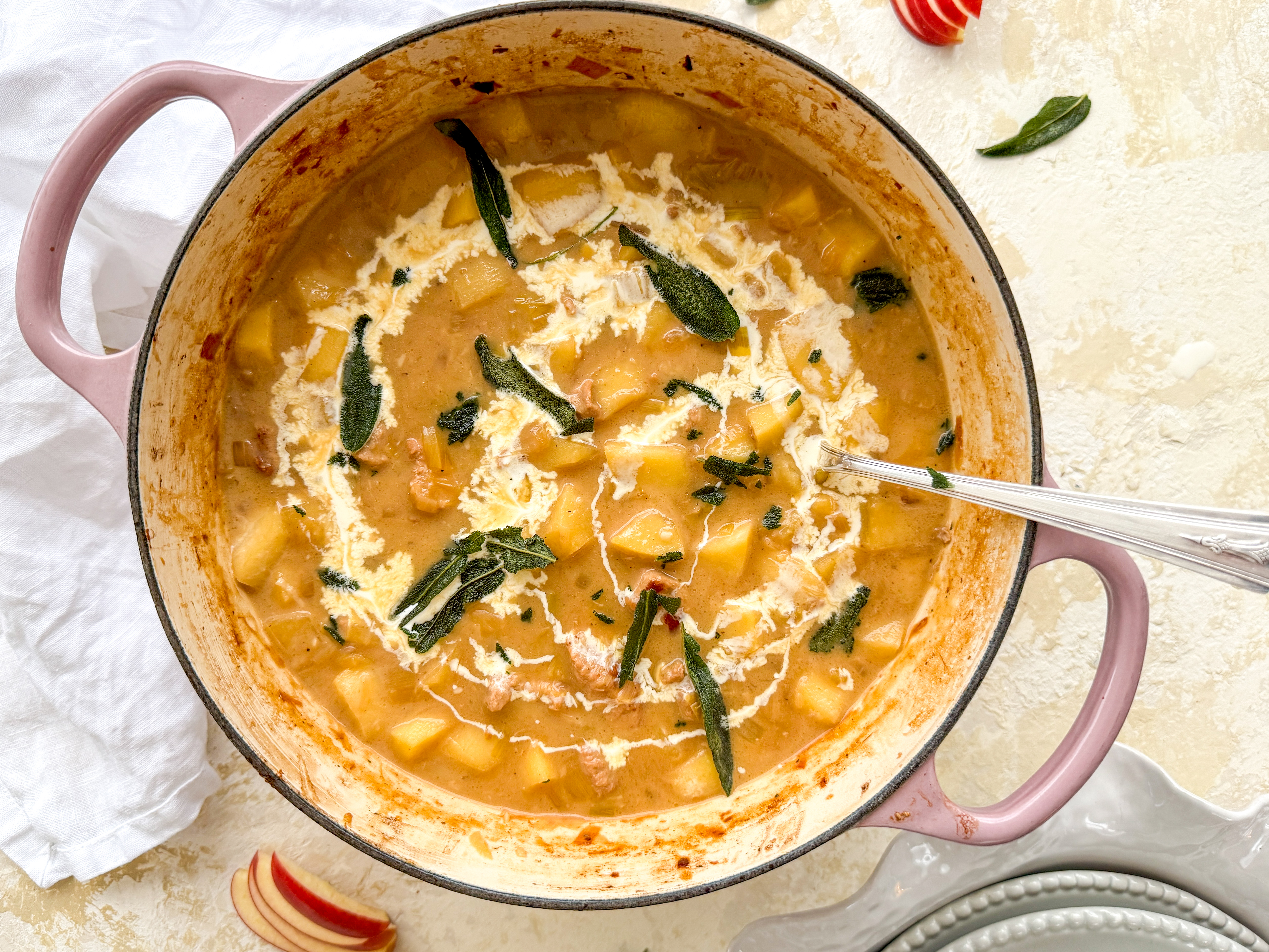 Photograph of Pork and Apple Casserole with Cider and Crispy Sage